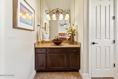 SITED ON PARK-LIKE GROUNDS WITHIN PROMENADE PARKE, THE on Venetian Bay Golf Course in Florida - for sale on GolfHomes.com, golf home, golf lot