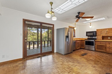 Stunning Hideaway Lake Retreat with Partial Water Views on Hide-A-Way Lake Golf Course in Texas - for sale on GolfHomes.com, golf home, golf lot