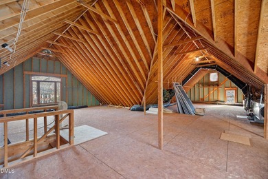 Don't miss walking over the bridge to this wonderful on Devils Ridge Golf Club in North Carolina - for sale on GolfHomes.com, golf home, golf lot