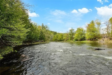A River runs through it (well, right in front of it for a on Concord Resort and Golf Club in New York - for sale on GolfHomes.com, golf home, golf lot