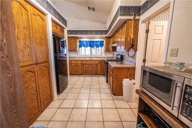 Nestled at 7820 E Devils Arch Dr, Kingman, Arizona, this on Valle Vista Golf Course in Arizona - for sale on GolfHomes.com, golf home, golf lot