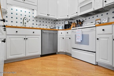 Waterfront overlooking a tranquil pond, this exquisitely on Members Club At St. James Plantation in North Carolina - for sale on GolfHomes.com, golf home, golf lot