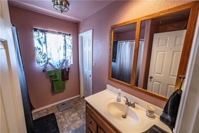 Nestled at 7820 E Devils Arch Dr, Kingman, Arizona, this on Valle Vista Golf Course in Arizona - for sale on GolfHomes.com, golf home, golf lot