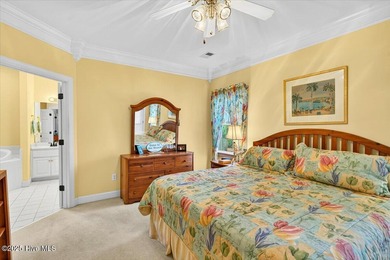 Waterfront overlooking a tranquil pond, this exquisitely on Members Club At St. James Plantation in North Carolina - for sale on GolfHomes.com, golf home, golf lot