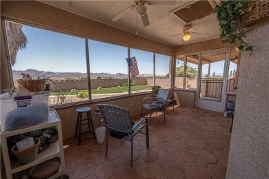 Nestled at 7820 E Devils Arch Dr, Kingman, Arizona, this on Valle Vista Golf Course in Arizona - for sale on GolfHomes.com, golf home, golf lot