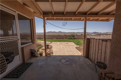 Nestled at 7820 E Devils Arch Dr, Kingman, Arizona, this on Valle Vista Golf Course in Arizona - for sale on GolfHomes.com, golf home, golf lot
