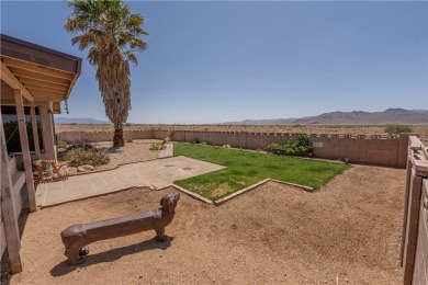 Nestled at 7820 E Devils Arch Dr, Kingman, Arizona, this on Valle Vista Golf Course in Arizona - for sale on GolfHomes.com, golf home, golf lot