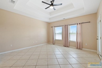 Step into comfort and style in this inviting golf course home on South Padre Island Golf Club in Texas - for sale on GolfHomes.com, golf home, golf lot