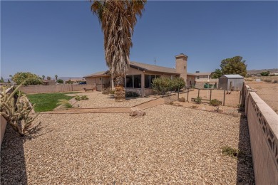 Nestled at 7820 E Devils Arch Dr, Kingman, Arizona, this on Valle Vista Golf Course in Arizona - for sale on GolfHomes.com, golf home, golf lot