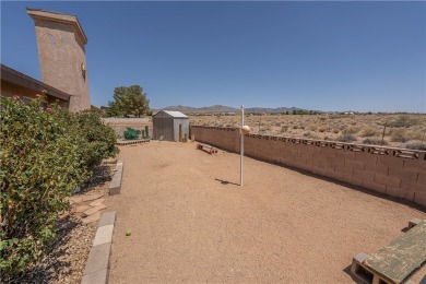 Nestled at 7820 E Devils Arch Dr, Kingman, Arizona, this on Valle Vista Golf Course in Arizona - for sale on GolfHomes.com, golf home, golf lot