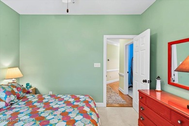 Waterfront overlooking a tranquil pond, this exquisitely on Members Club At St. James Plantation in North Carolina - for sale on GolfHomes.com, golf home, golf lot