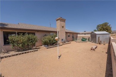 Nestled at 7820 E Devils Arch Dr, Kingman, Arizona, this on Valle Vista Golf Course in Arizona - for sale on GolfHomes.com, golf home, golf lot