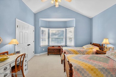 Waterfront overlooking a tranquil pond, this exquisitely on Members Club At St. James Plantation in North Carolina - for sale on GolfHomes.com, golf home, golf lot