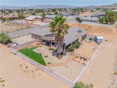 Nestled at 7820 E Devils Arch Dr, Kingman, Arizona, this on Valle Vista Golf Course in Arizona - for sale on GolfHomes.com, golf home, golf lot