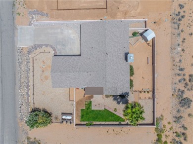 Nestled at 7820 E Devils Arch Dr, Kingman, Arizona, this on Valle Vista Golf Course in Arizona - for sale on GolfHomes.com, golf home, golf lot
