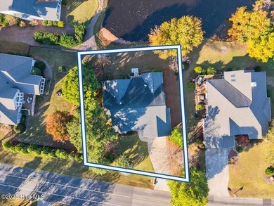 Waterfront overlooking a tranquil pond, this exquisitely on Members Club At St. James Plantation in North Carolina - for sale on GolfHomes.com, golf home, golf lot