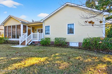 Waterfront overlooking a tranquil pond, this exquisitely on Members Club At St. James Plantation in North Carolina - for sale on GolfHomes.com, golf home, golf lot