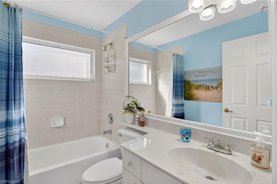 Welcome home to this beautiful Florida retreat with breezy Key on Fountain Lakes Community Golf Course in Florida - for sale on GolfHomes.com, golf home, golf lot