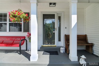WOW! This beautifully built home on the 13th hole of Raintree on Raintree Country Club in Missouri - for sale on GolfHomes.com, golf home, golf lot