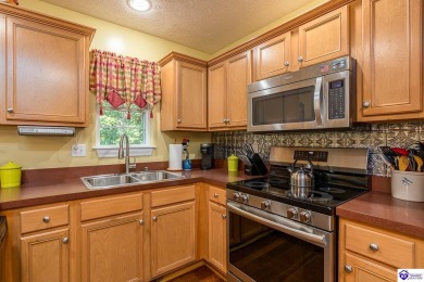 Don't let the exterior fool you--this Cape Cod-style home may on Doe Valley Country Club in Kentucky - for sale on GolfHomes.com, golf home, golf lot