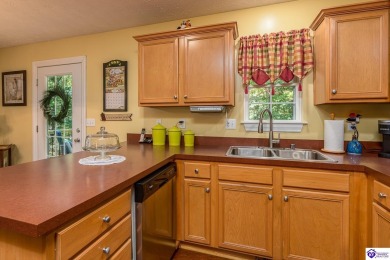 Don't let the exterior fool you--this Cape Cod-style home may on Doe Valley Country Club in Kentucky - for sale on GolfHomes.com, golf home, golf lot