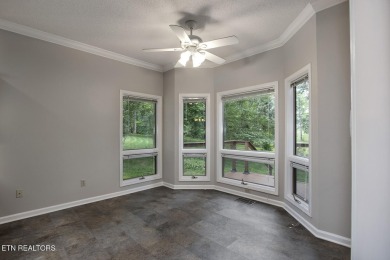 219 Oligi Circle is a charming single-story brick home located on Toqua Golf Course - Loudon County in Tennessee - for sale on GolfHomes.com, golf home, golf lot