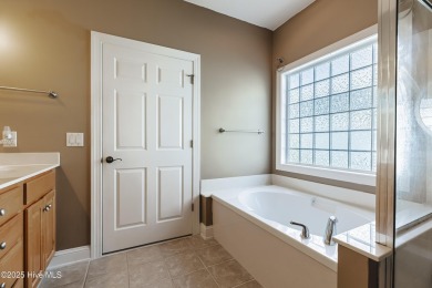 Welcome to this 4-bedroom, 3.5-bath home in the sought-after Sea on Sea Trail Golf Resort in North Carolina - for sale on GolfHomes.com, golf home, golf lot