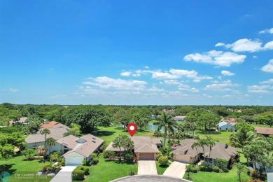 WELCOME TO 5628 PLEASANT VALLEY LANE -- A SERENE RETREAT NESTLED on Boca Delray Golf and Country Club in Florida - for sale on GolfHomes.com, golf home, golf lot