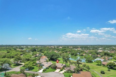 WELCOME TO 5628 PLEASANT VALLEY LANE -- A SERENE RETREAT NESTLED on Boca Delray Golf and Country Club in Florida - for sale on GolfHomes.com, golf home, golf lot