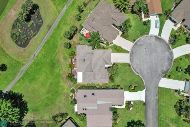 WELCOME TO 5628 PLEASANT VALLEY LANE -- A SERENE RETREAT NESTLED on Boca Delray Golf and Country Club in Florida - for sale on GolfHomes.com, golf home, golf lot