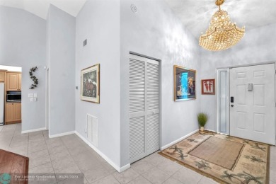 WELCOME TO 5628 PLEASANT VALLEY LANE -- A SERENE RETREAT NESTLED on Boca Delray Golf and Country Club in Florida - for sale on GolfHomes.com, golf home, golf lot