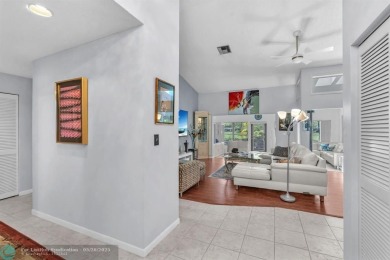 WELCOME TO 5628 PLEASANT VALLEY LANE -- A SERENE RETREAT NESTLED on Boca Delray Golf and Country Club in Florida - for sale on GolfHomes.com, golf home, golf lot