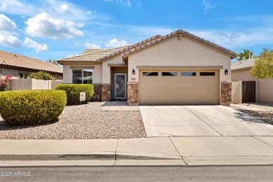 This wonderful single-story residence offers 3 spacious bedrooms on The Golf Club At Johnson Ranch in Arizona - for sale on GolfHomes.com, golf home, golf lot