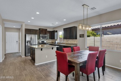 This wonderful single-story residence offers 3 spacious bedrooms on The Golf Club At Johnson Ranch in Arizona - for sale on GolfHomes.com, golf home, golf lot