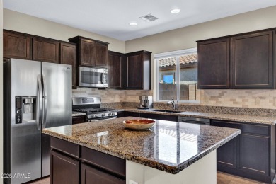 This wonderful single-story residence offers 3 spacious bedrooms on The Golf Club At Johnson Ranch in Arizona - for sale on GolfHomes.com, golf home, golf lot