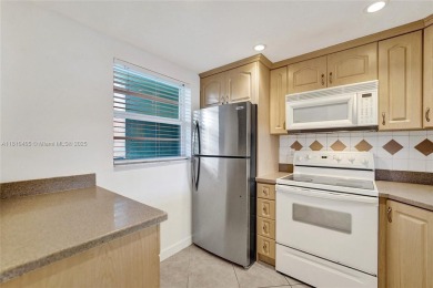 Beautifully maintained 2-bedroom, 2-bath in the highly on Pine Island Ridge Country Club in Florida - for sale on GolfHomes.com, golf home, golf lot