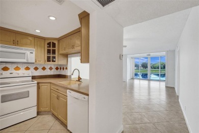 Beautifully maintained 2-bedroom, 2-bath in the highly on Pine Island Ridge Country Club in Florida - for sale on GolfHomes.com, golf home, golf lot