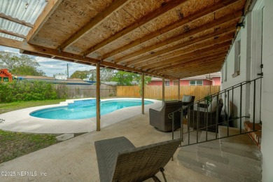 This well-maintained 1960s concrete block home blends classic on Blue Cypress Golf Club in Florida - for sale on GolfHomes.com, golf home, golf lot