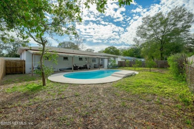 This well-maintained 1960s concrete block home blends classic on Blue Cypress Golf Club in Florida - for sale on GolfHomes.com, golf home, golf lot