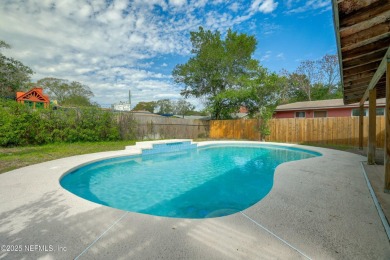 This well-maintained 1960s concrete block home blends classic on Blue Cypress Golf Club in Florida - for sale on GolfHomes.com, golf home, golf lot