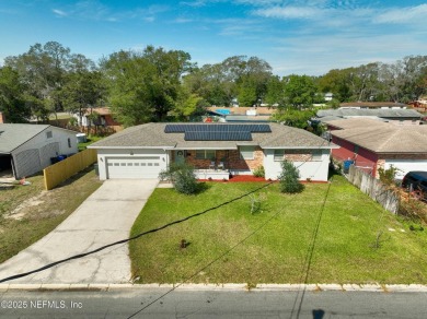 This well-maintained 1960s concrete block home blends classic on Blue Cypress Golf Club in Florida - for sale on GolfHomes.com, golf home, golf lot