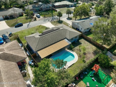 This well-maintained 1960s concrete block home blends classic on Blue Cypress Golf Club in Florida - for sale on GolfHomes.com, golf home, golf lot