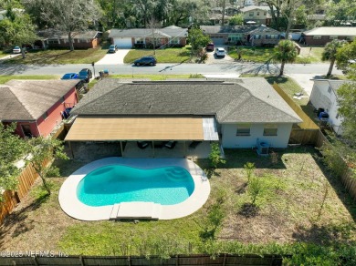 This well-maintained 1960s concrete block home blends classic on Blue Cypress Golf Club in Florida - for sale on GolfHomes.com, golf home, golf lot