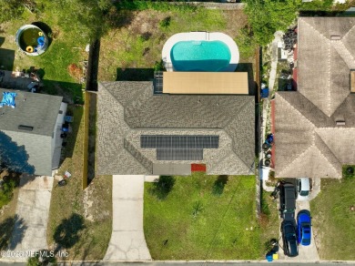 This well-maintained 1960s concrete block home blends classic on Blue Cypress Golf Club in Florida - for sale on GolfHomes.com, golf home, golf lot