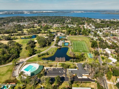 This well-maintained 1960s concrete block home blends classic on Blue Cypress Golf Club in Florida - for sale on GolfHomes.com, golf home, golf lot