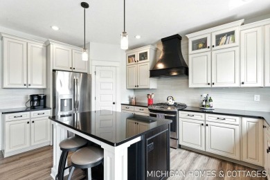 Welcome to 4401 Grand Point, a stunning home nestled on nearly on The Macatwa Legends Golf Course in Michigan - for sale on GolfHomes.com, golf home, golf lot
