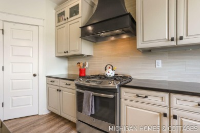 Welcome to 4401 Grand Point, a stunning home nestled on nearly on The Macatwa Legends Golf Course in Michigan - for sale on GolfHomes.com, golf home, golf lot