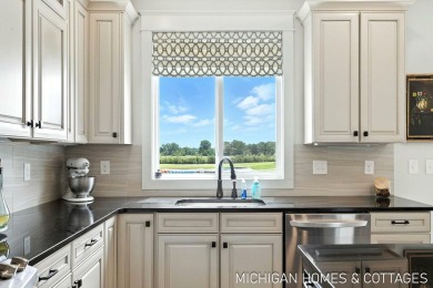 Welcome to 4401 Grand Point, a stunning home nestled on nearly on The Macatwa Legends Golf Course in Michigan - for sale on GolfHomes.com, golf home, golf lot
