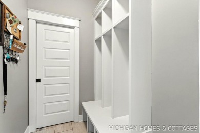 Welcome to 4401 Grand Point, a stunning home nestled on nearly on The Macatwa Legends Golf Course in Michigan - for sale on GolfHomes.com, golf home, golf lot