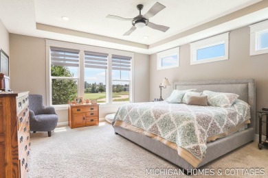 Welcome to 4401 Grand Point, a stunning home nestled on nearly on The Macatwa Legends Golf Course in Michigan - for sale on GolfHomes.com, golf home, golf lot